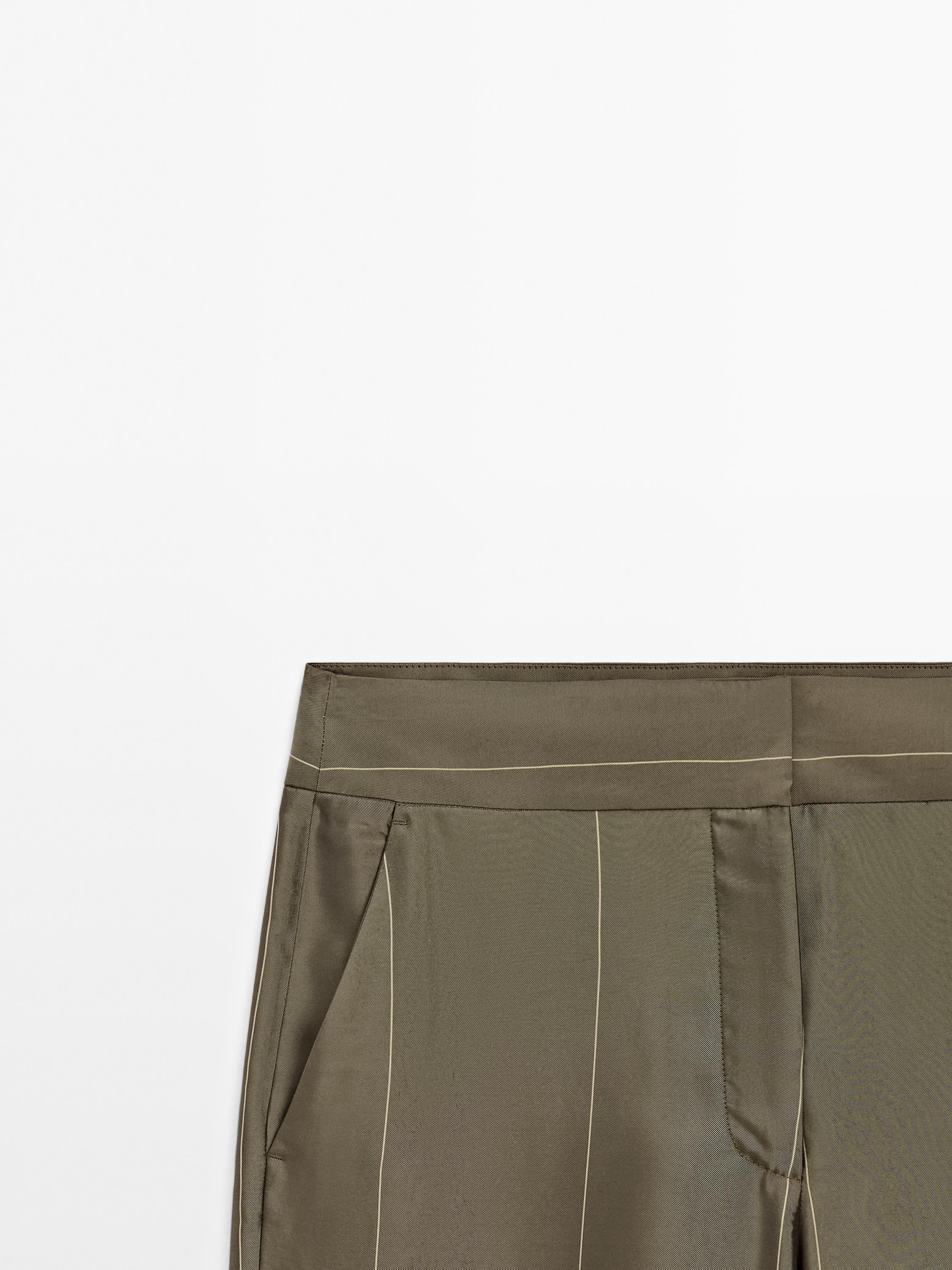 Flowing trousers with striped details